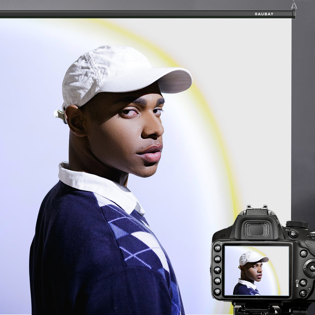 White pull down projector screen with portrait and camera preview